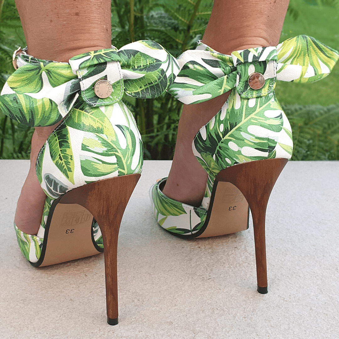 High stiletto sandals with a an ankle strap and a bow