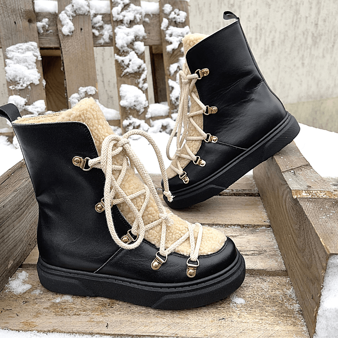 Lace up fur trim stomper boots in black leather