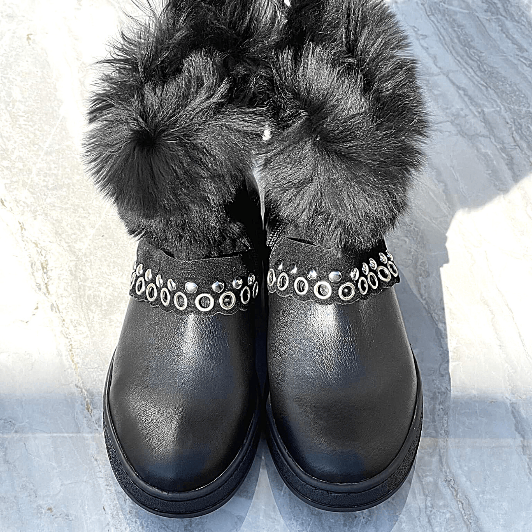 Black leather snow boots with black fur trim