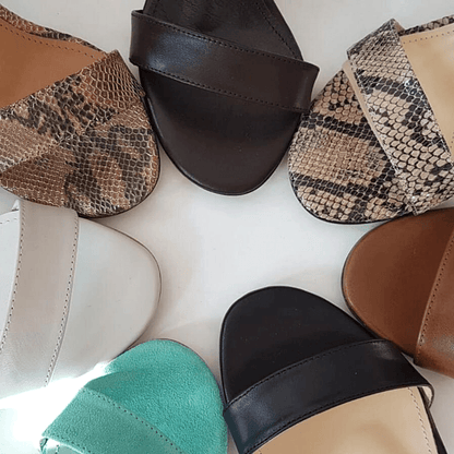 Collection on open toe sandals in black, mint, white and brown leather