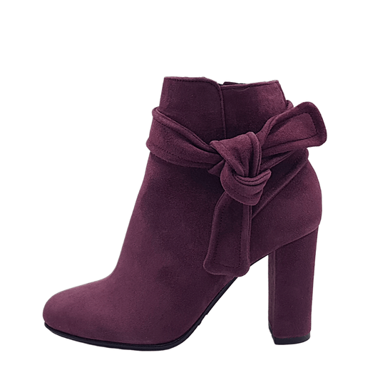 Burgundy suede ankle boots with a decorative bow to the side