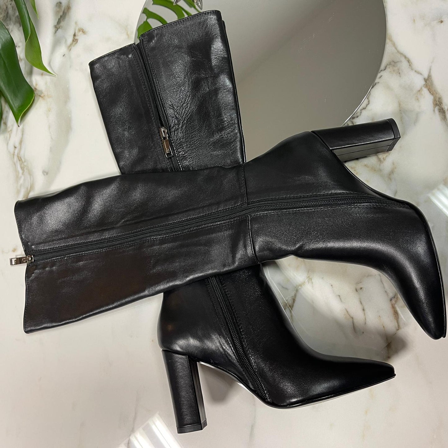 Small size ladies knee heigh boots in black leather