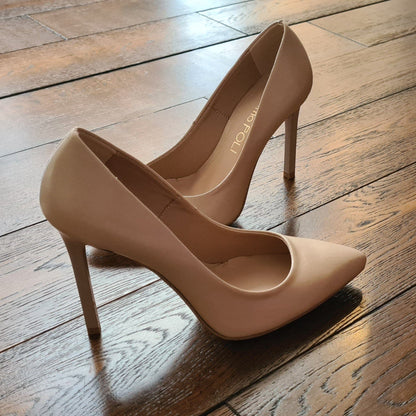 Nude leather court shoes set on a stiletto heel
