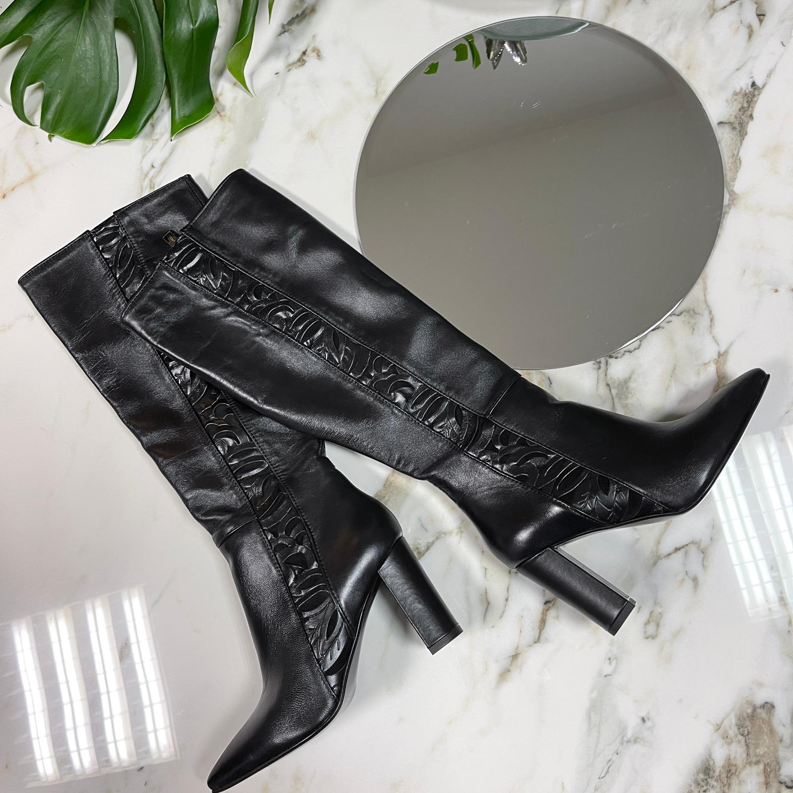 Black leather knee height boots