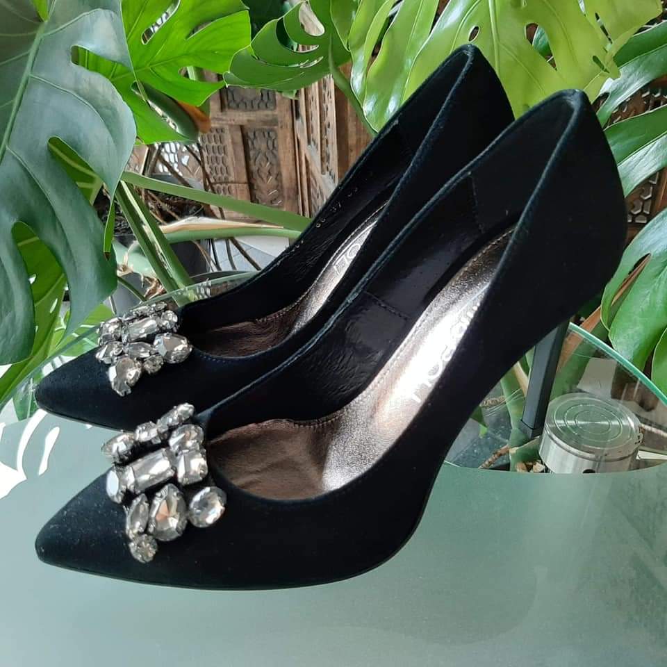 Black suede court heels with a crystal brooch