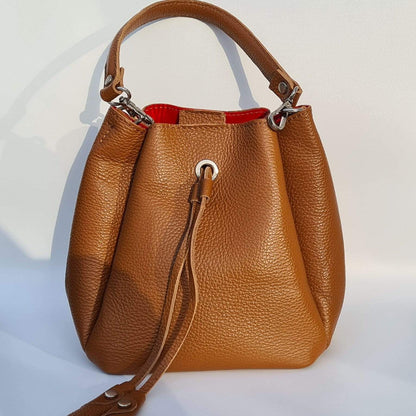 Genuine tan leather grab bag with a handle and a shoulder strap