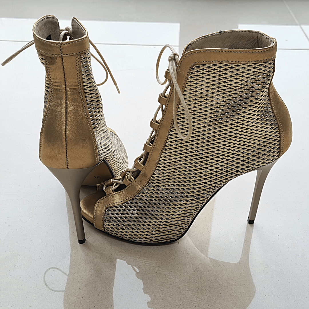 Lace up gold stiletto boots