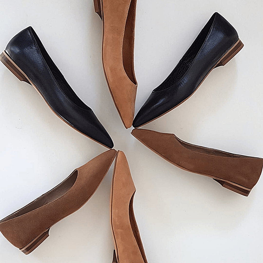 Collection of flat ballerina shoes in black tan and brown colours