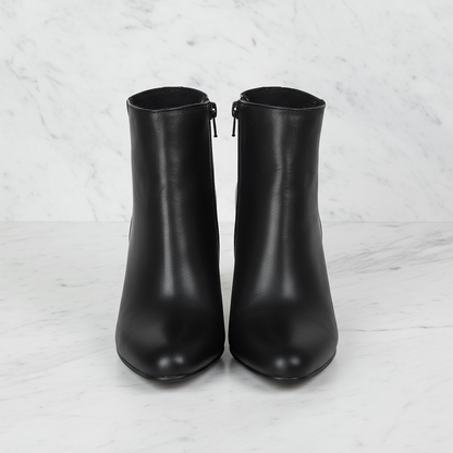 Almond toe ankle boots in black leather with a side zipper, designed for petite feet.